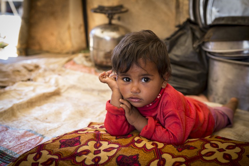 Zeina *, two, at her home in a tented refugee settlement in Lebanon, near the Syrian border. *Names have been changed to protect identities. Photo credit: Jonathan Hyams/Save the Children