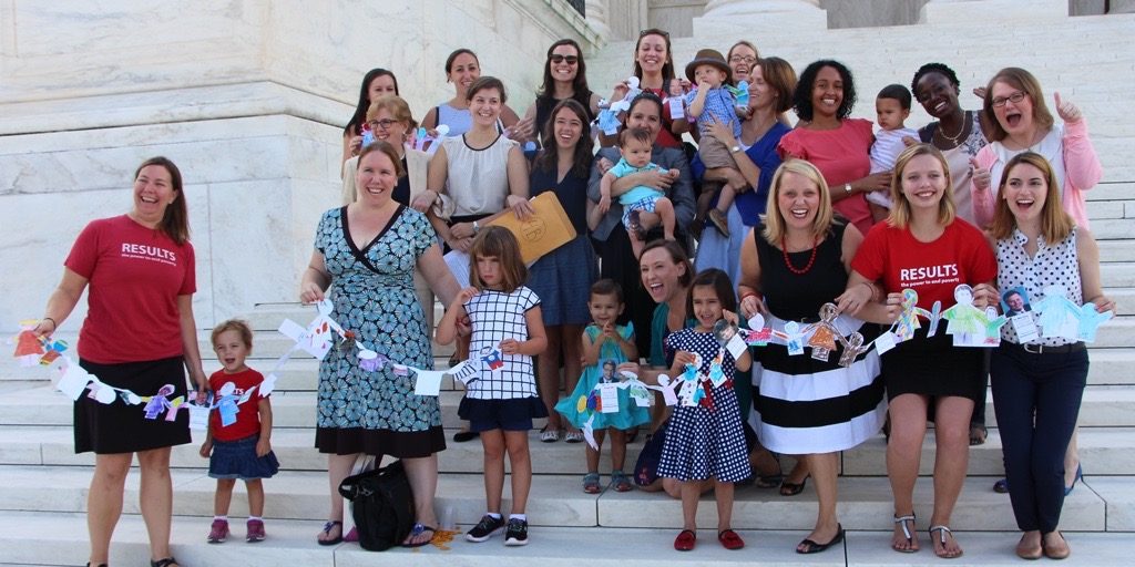 RESULTS staff and volunteer moms and kids in DC bringing paper dolls to senators in support of the Reach Act Photo Credit: RESULTS Educational Fund 
